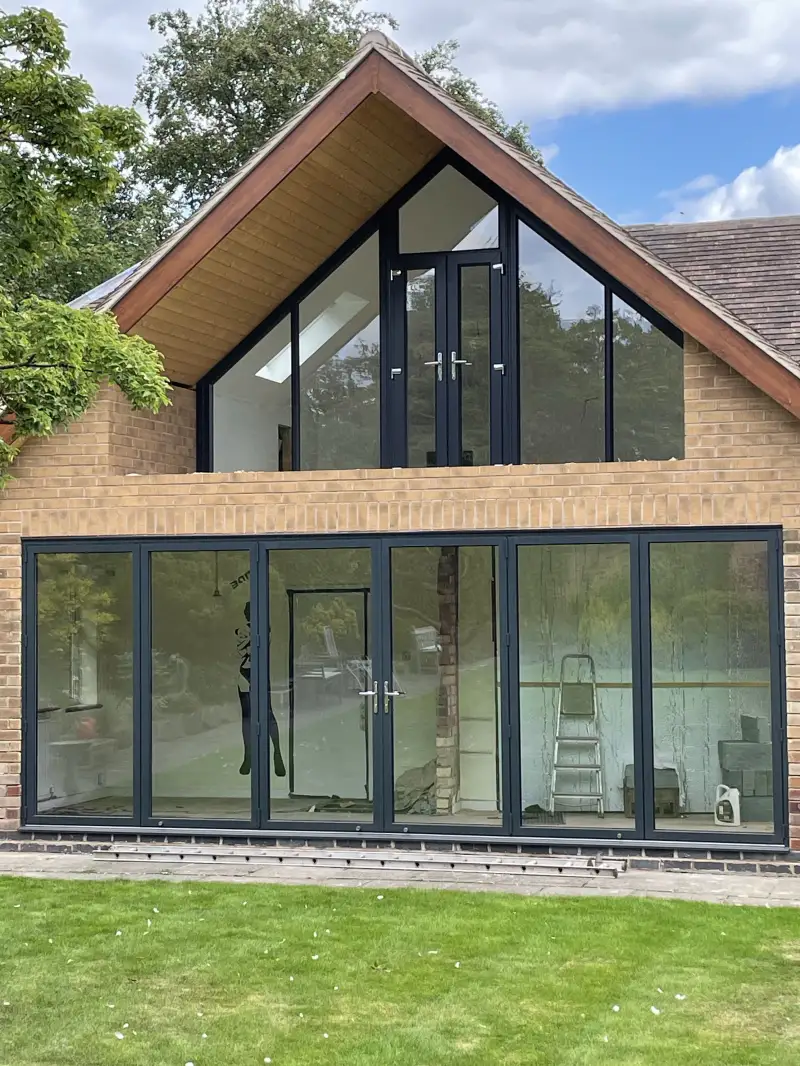 Anthracite Grey aluminium bifold. Double doors with shaped frames.: Swipe To View More Images