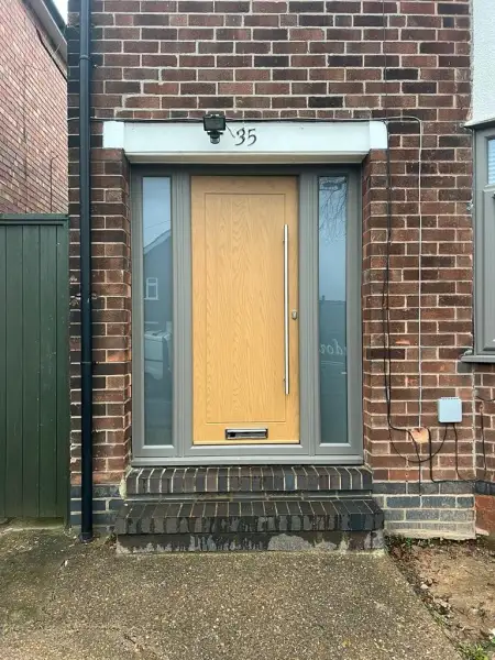Composite door with UPVC side panels in Trompet.: Swipe To View More Images