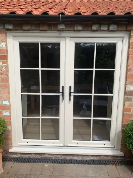 Double doors with Astragal bars in cream foil.: Swipe To View More Images