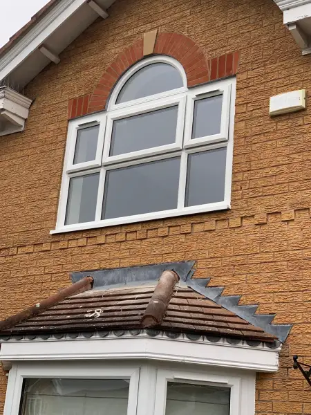 White windows with arched frame above.: Swipe To View More Images
