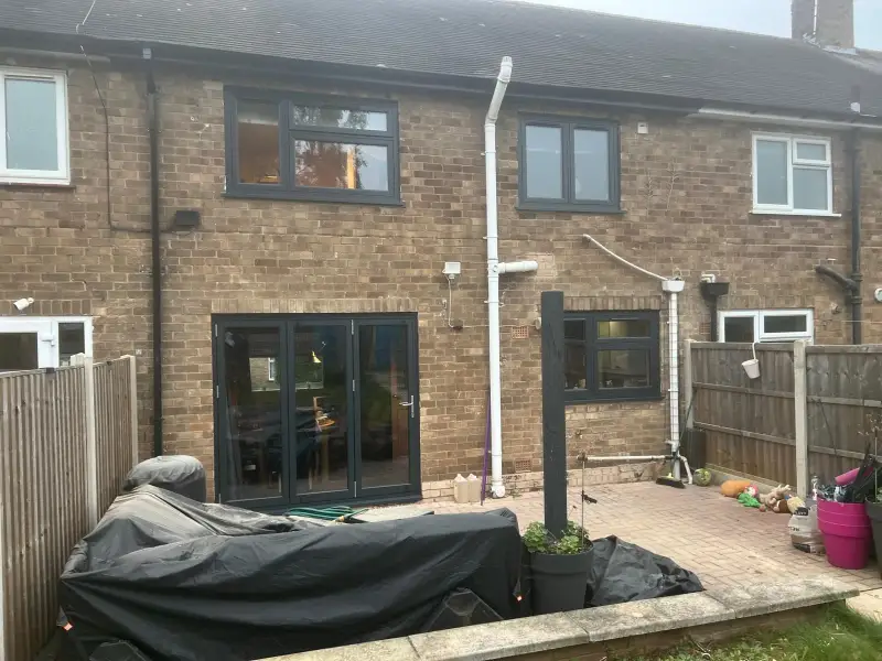 Flush sash Anthracite grey windows with Aluminium bifold door.: Swipe To View More Images