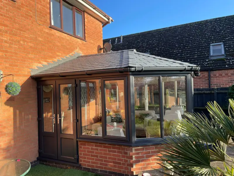 Grey&sol;White conservatory with warm imitation tiled roof&period;: Swipe To View More Images