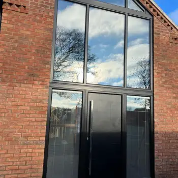 Black shaped frames with composite door and units with blinds.: Click Here To View Larger Image