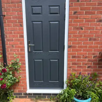 Slate grey composite door for a garage.: Click Here To View Larger Image